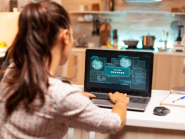 Hacker woman launching a cyberattack on bank firewall from home during night time. Programmer writing a dangerous malware for cyber attacks using performance laptop during midnight.